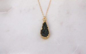 gold necklace with a teardrop druzy pendant